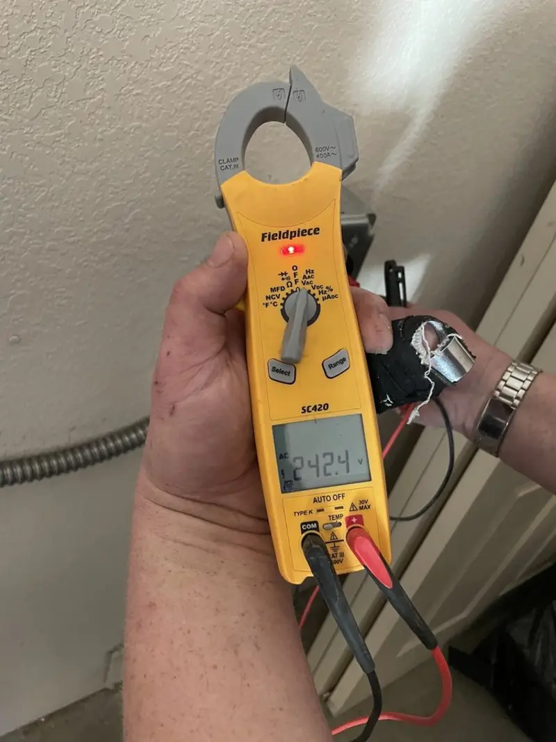 Voltage testing with clamp meter during Recessed Lighting Installation in Alma